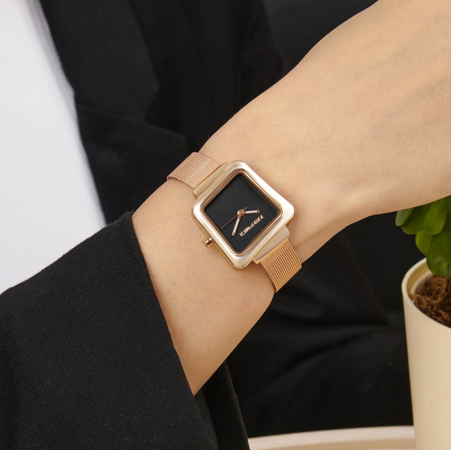 REGALIA ROSE GOLD WATCH WITH A BLACK DIAL AND A MESH STRAP