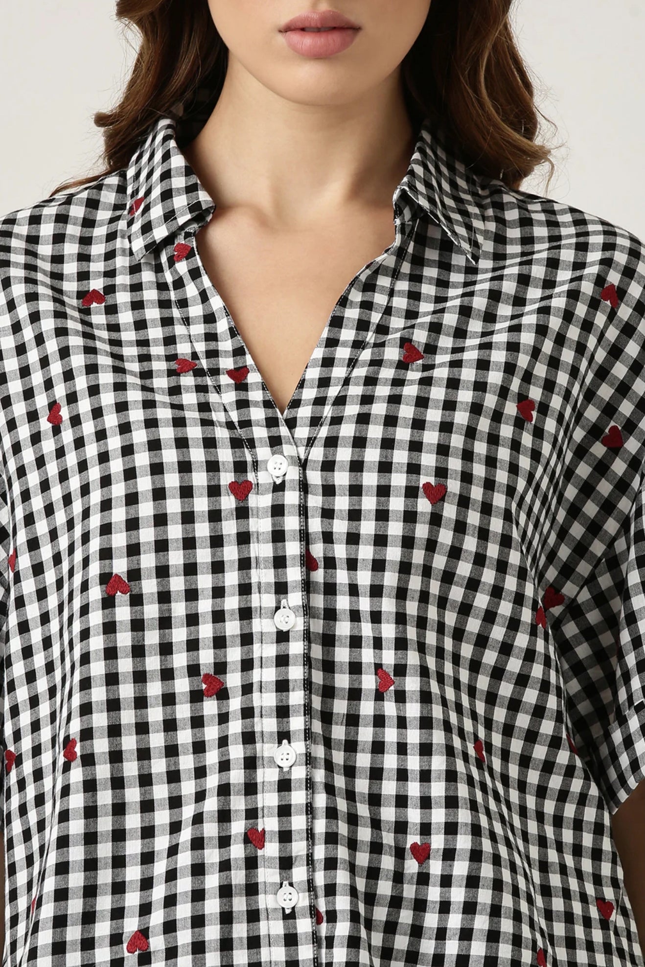 GINGHAM HEART EMBROIDERED SHIRT Classic checks? They just got a stylish upgrade. This shirt is all about fresh vibes and fun, made for the modern woman who knows how to make a statement.