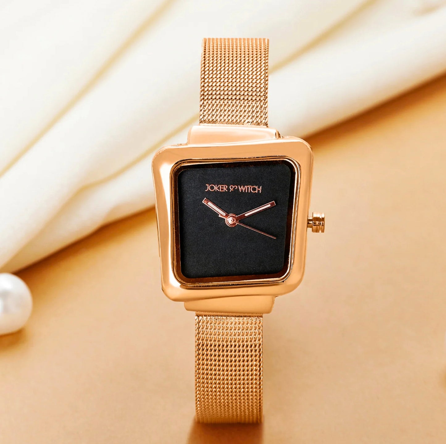 REGALIA ROSE GOLD WATCH WITH A BLACK DIAL AND A MESH STRAP